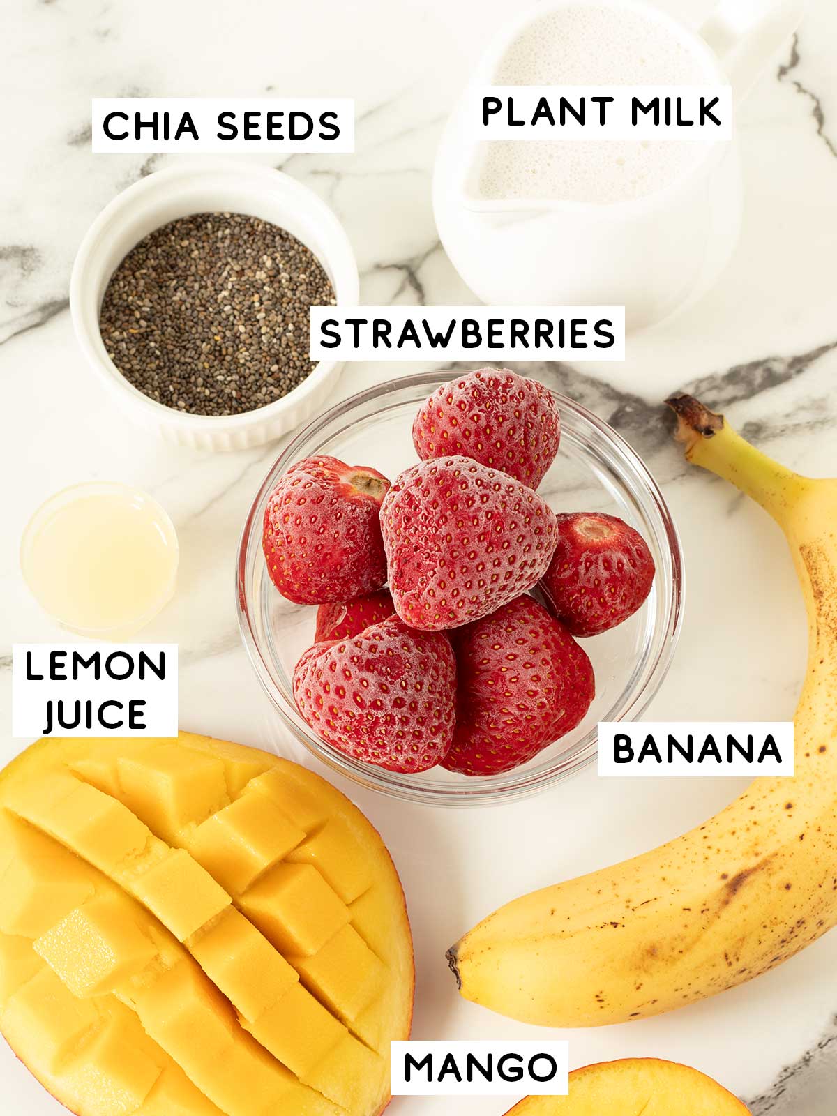 Mango strawberry banana smoothie ingredients.