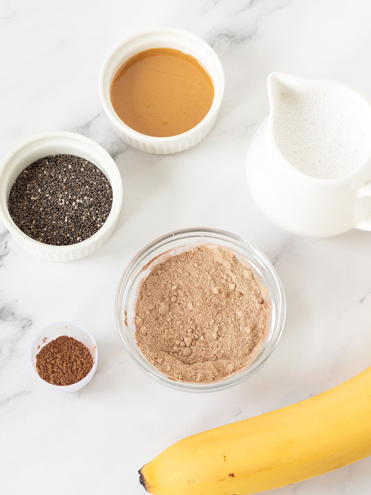 Ingredients for chocolate banana protein smoothie.