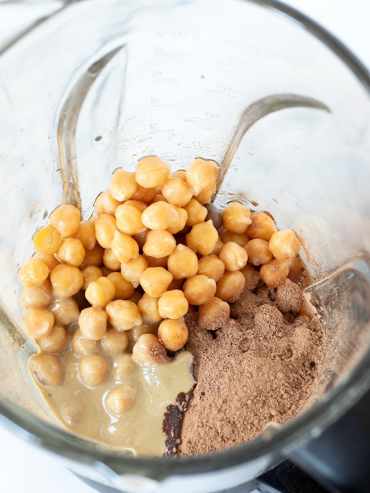 Ingredients for chocolate sweet hummus in a blender.