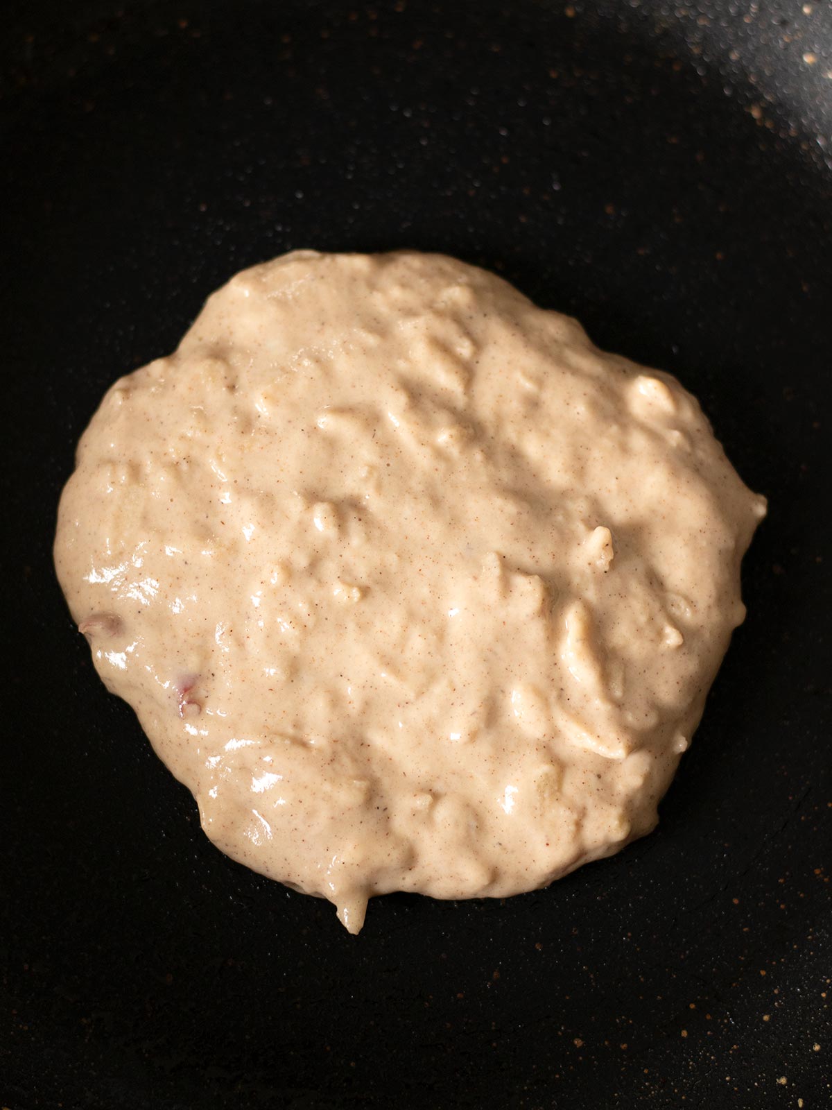 Cooking apple cinnamon pancake.