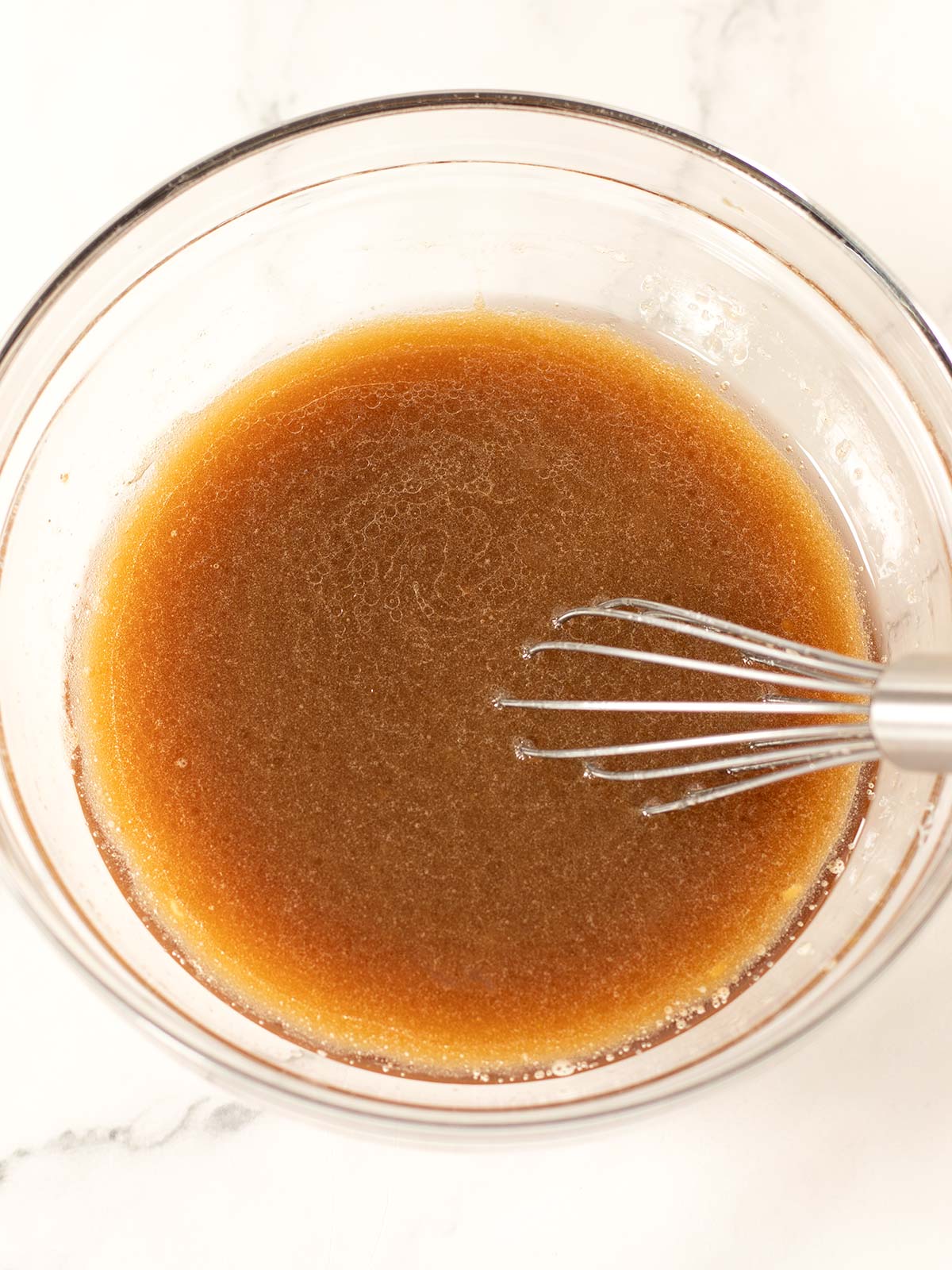 Mixing wet ingredients for lemon blueberry cookies.