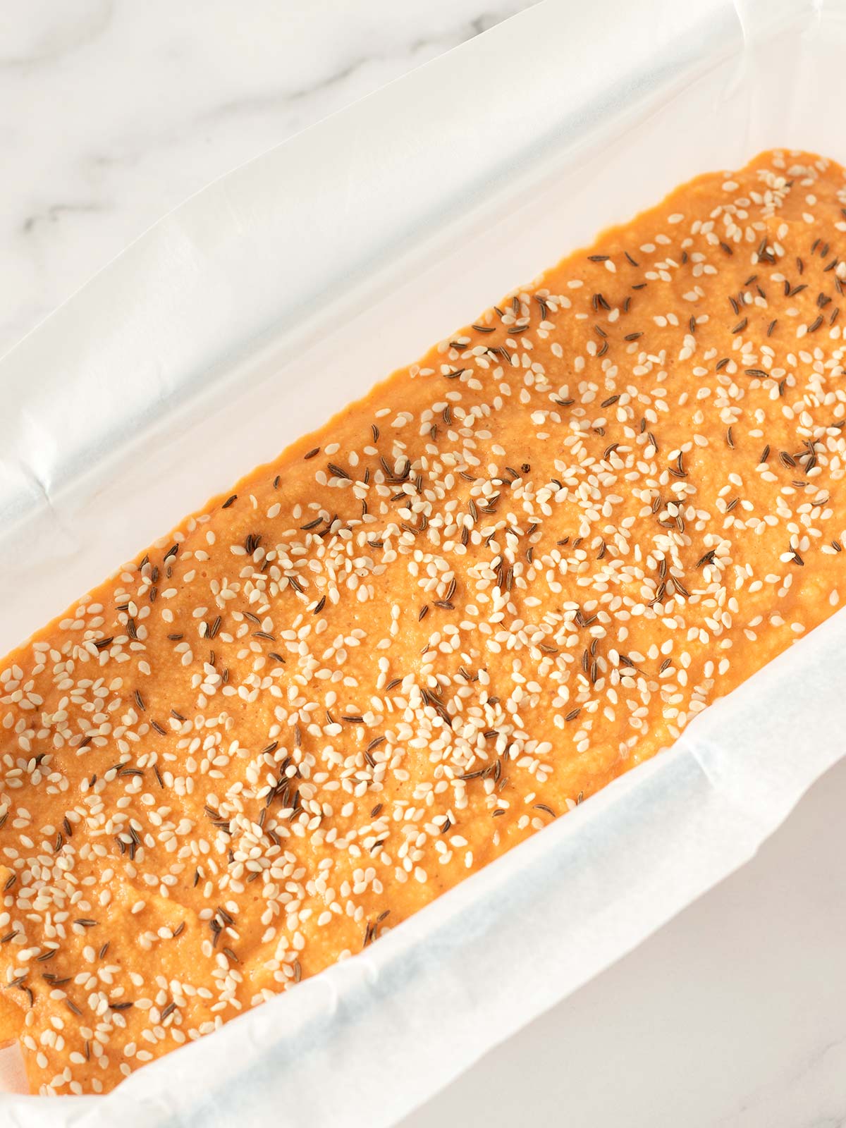 Red lentil bread prepared for baking.