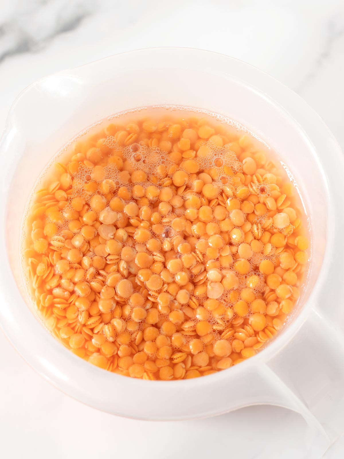 Soaked red lentils for gluten-free bread.