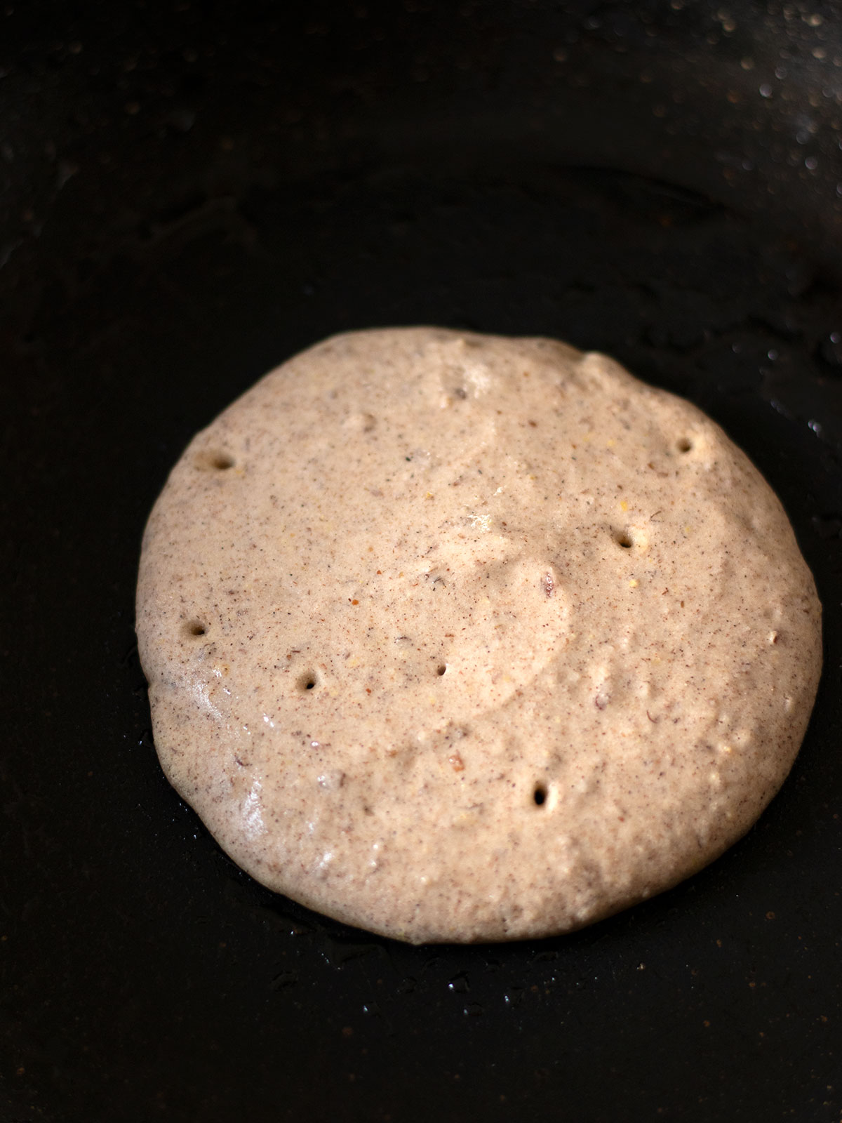 Cooking gluten-free buckwheat pancake.