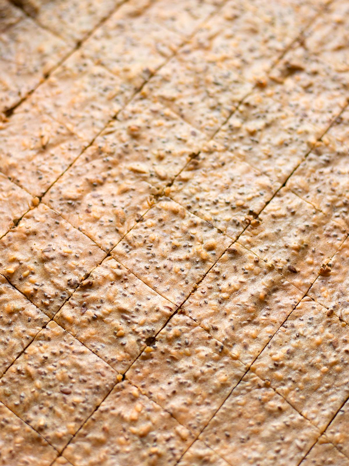 Cutting red lentil crackers.