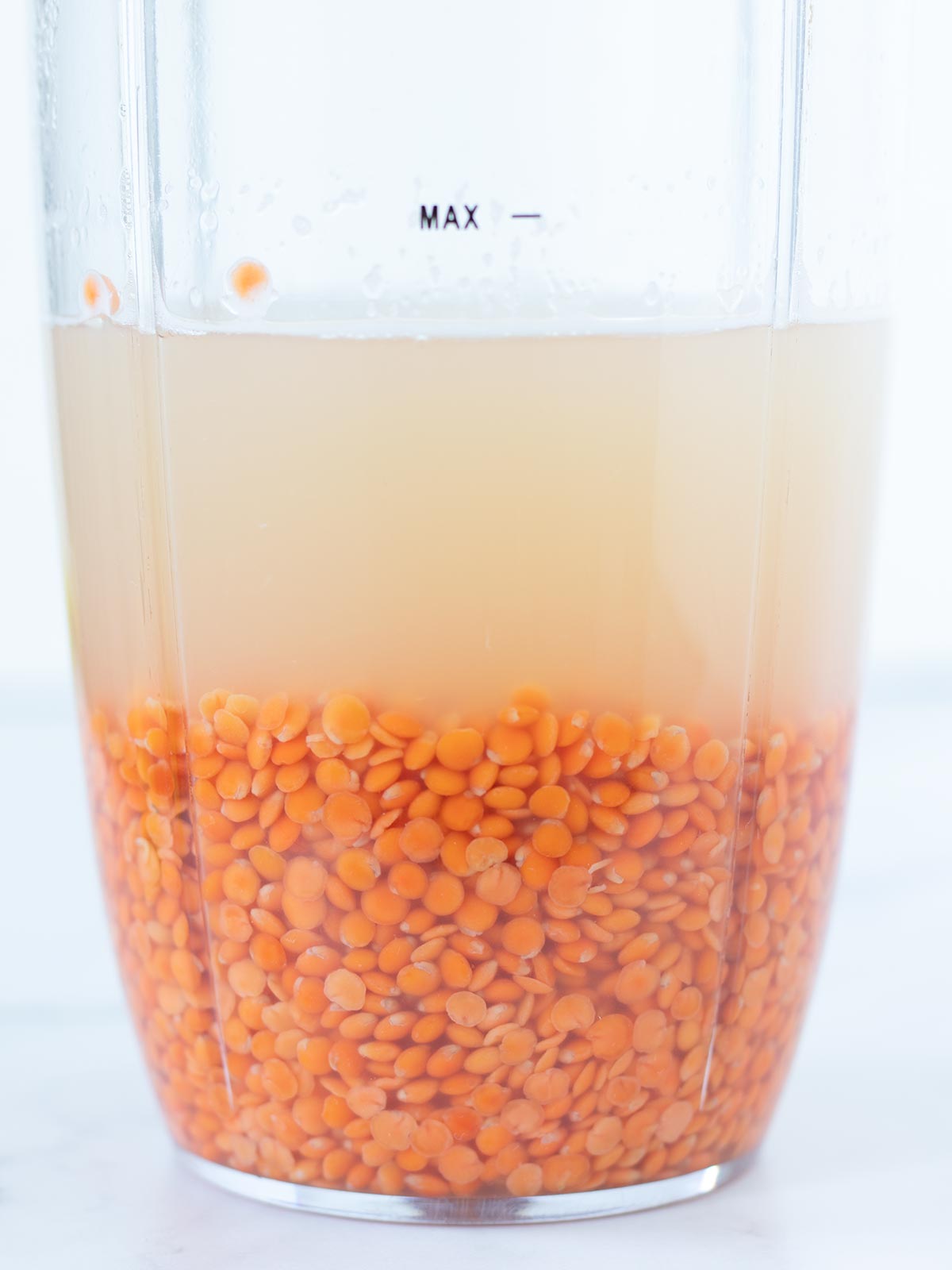 Soaking red lentils for homemade gluten-free crackers.