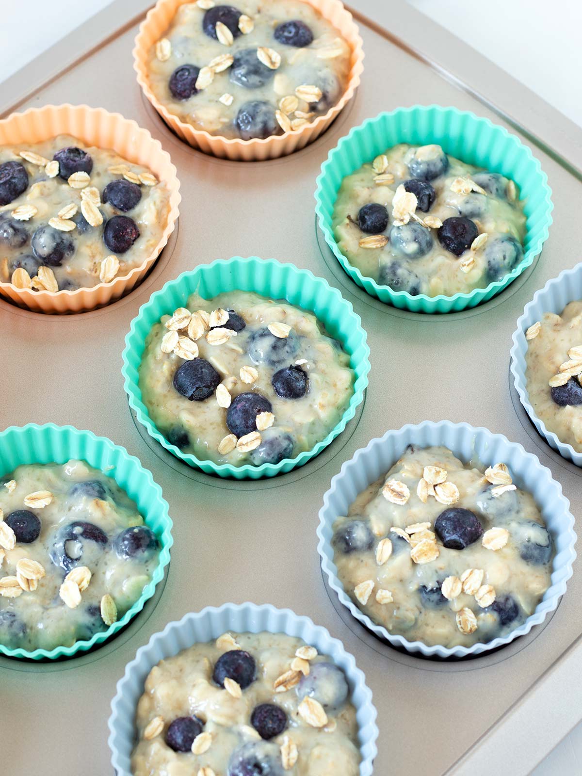 Vegan banana blueberry oatmeal muffins prepared for baking.