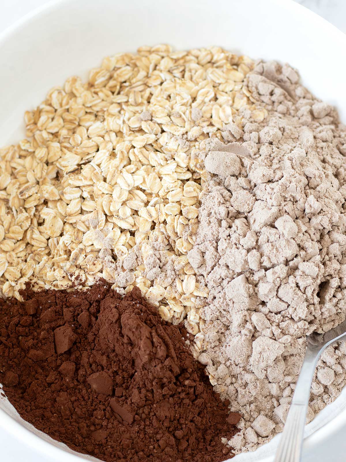 Dry ingredients for no-bake chocolate protein oatmeal cookies.