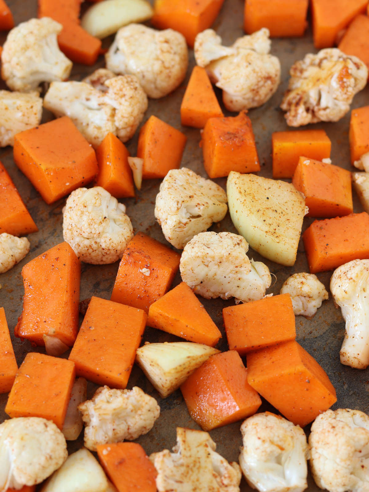 Chopped cauliflower and pumpkin with spices.