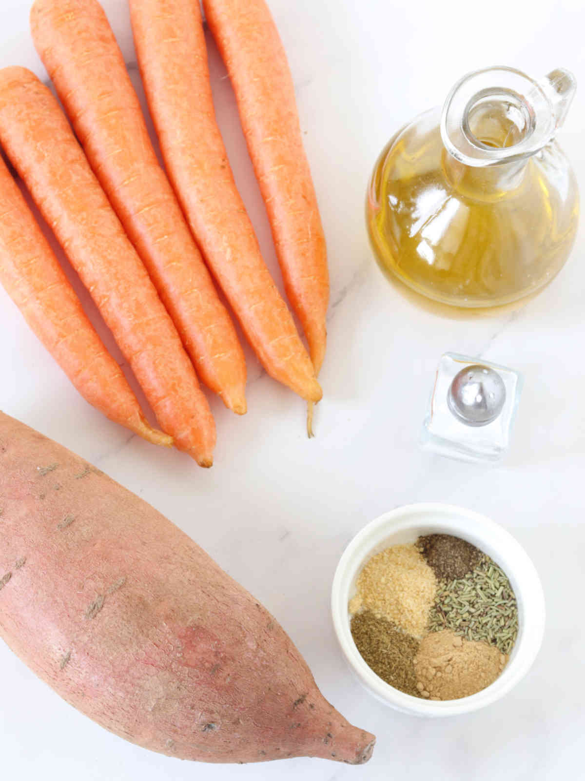 Ingredients for roasted sweet potatoes and carrots.