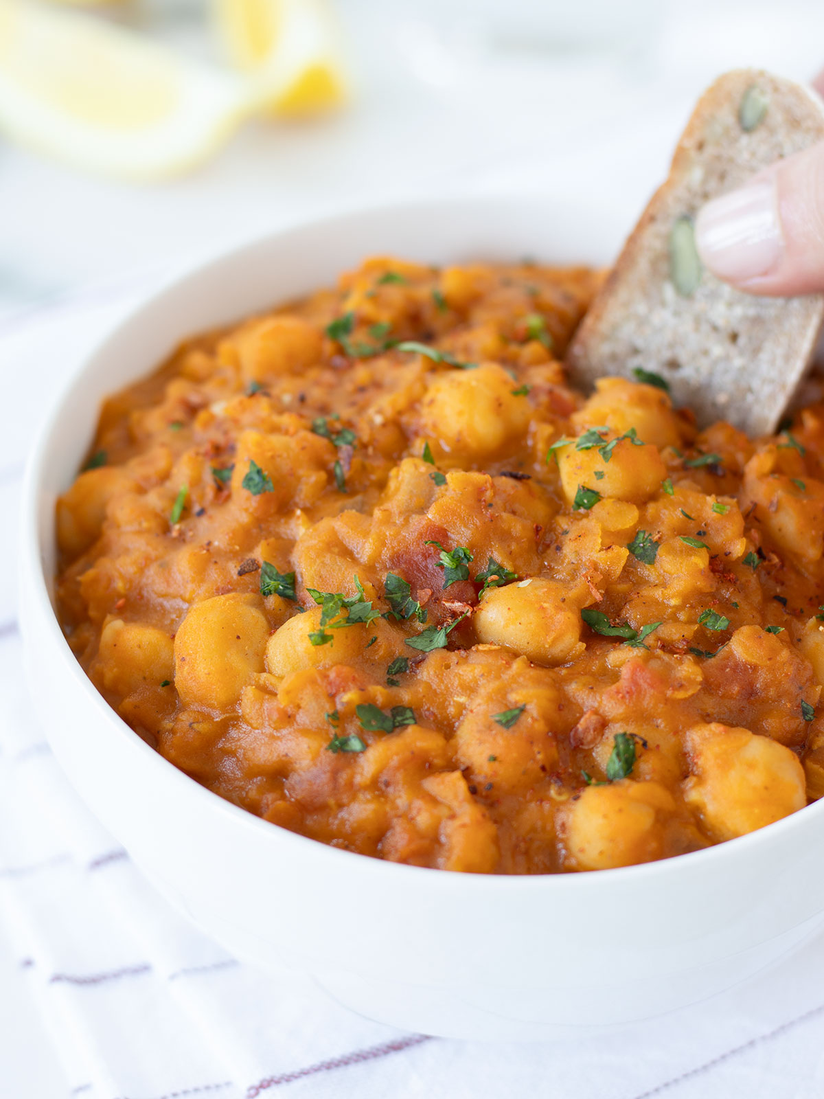 Vegan chickpea red lentil curry with coconut milk.