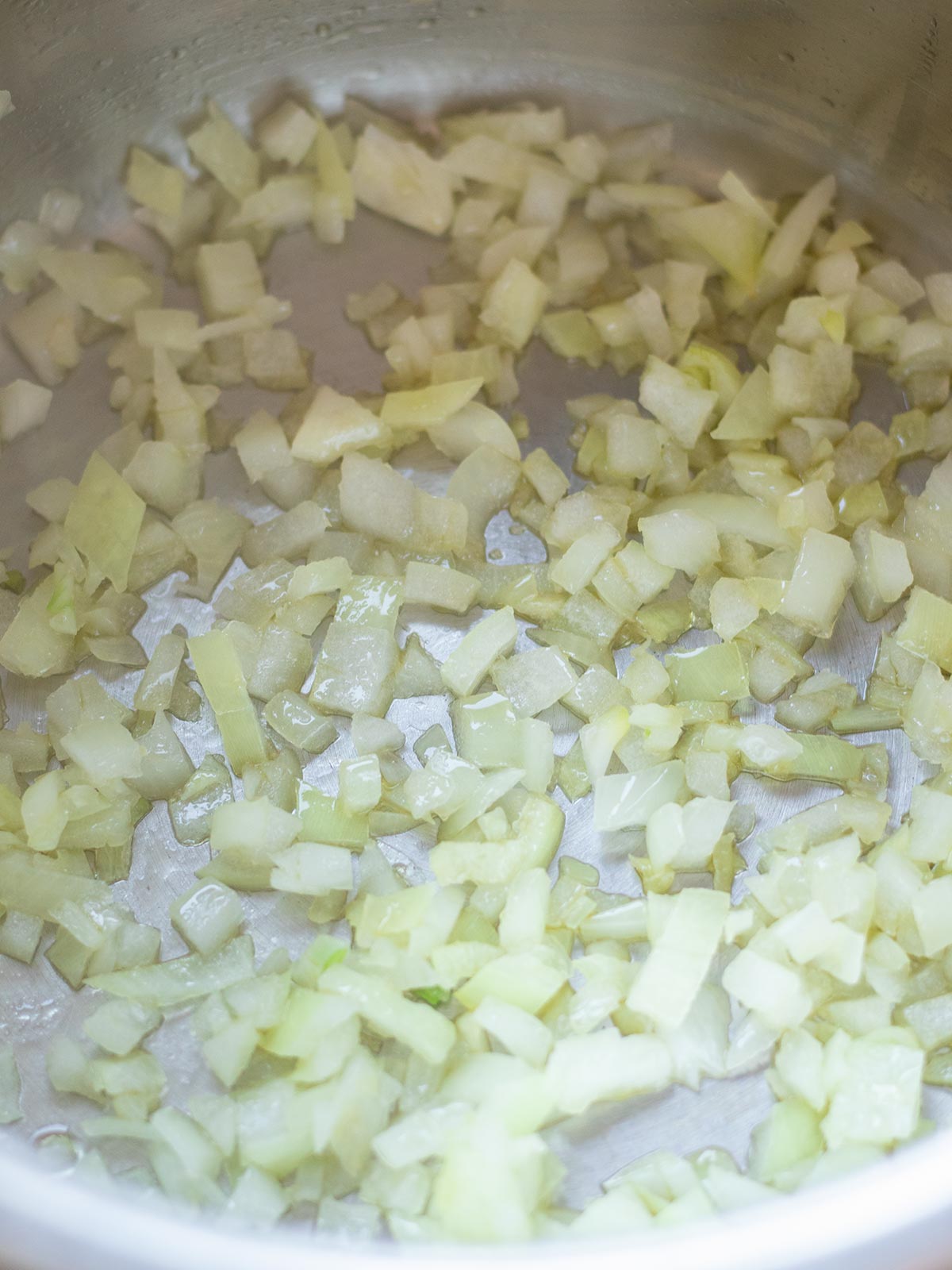Cooking onion for red lentil chickpea curry.