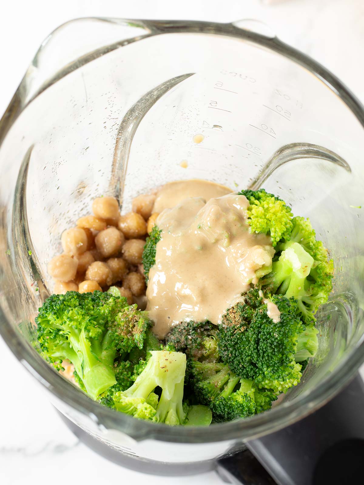 Ingredients for broccoli hummus in a blender.