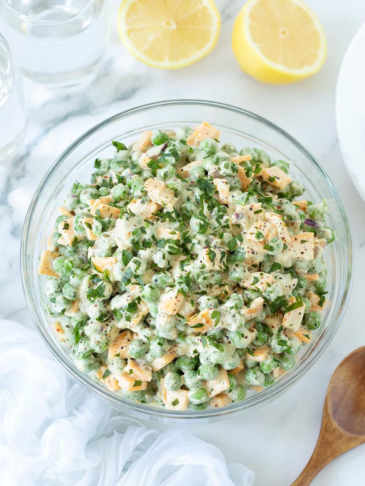 Vegan green pea salad with cheddar cheese.
