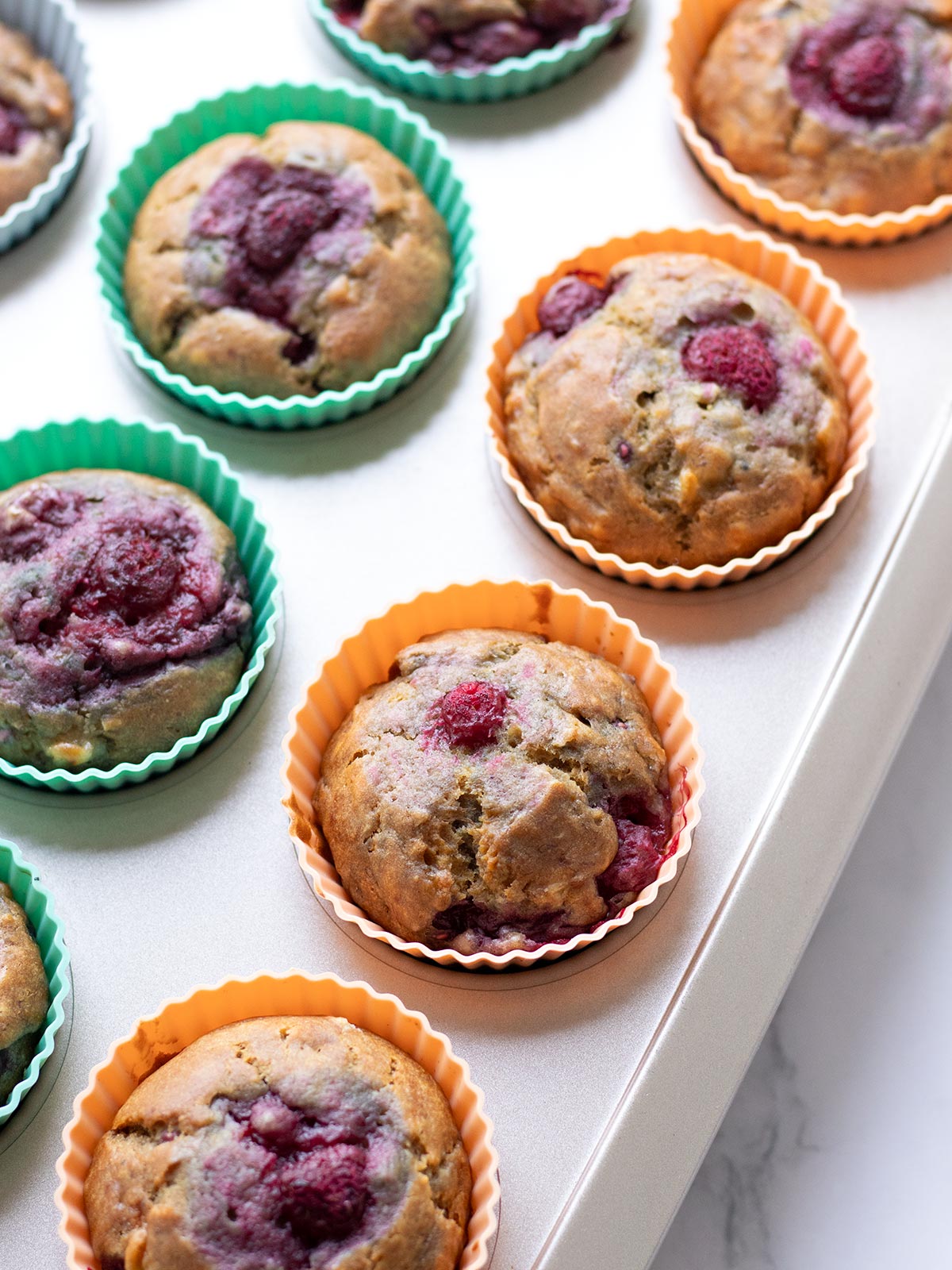 Freshly baked raspberry banana muffins.