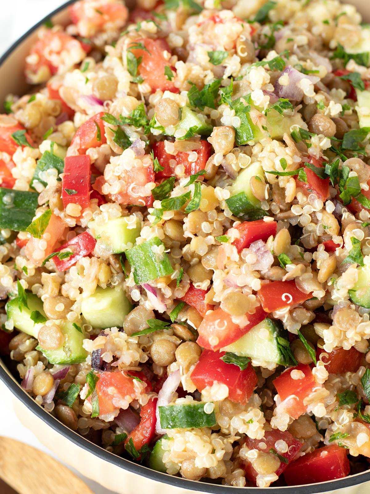 High protein lentil quinoa salad with veggies.