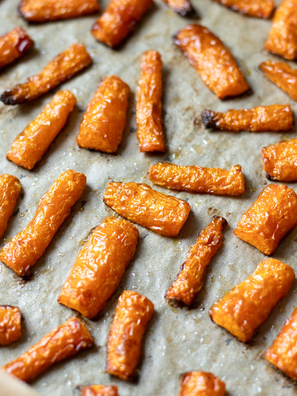 Roasted carrots on a baking sheet.