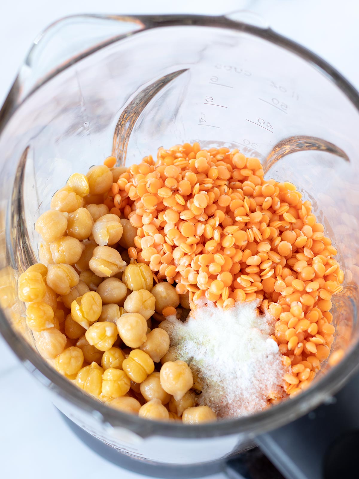 Red lentil chickpea bread ingredients in a blender.