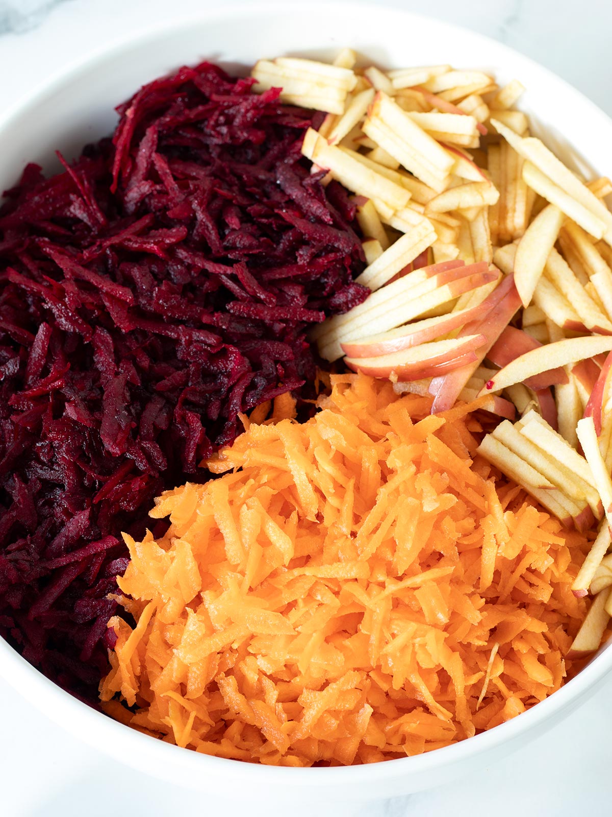 Grated raw beet carrot and apple salad.