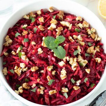 Raw beetroot carrot apple salad with walnuts.