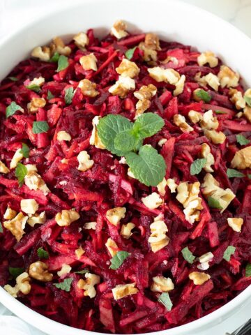 Raw beetroot carrot apple salad with walnuts.