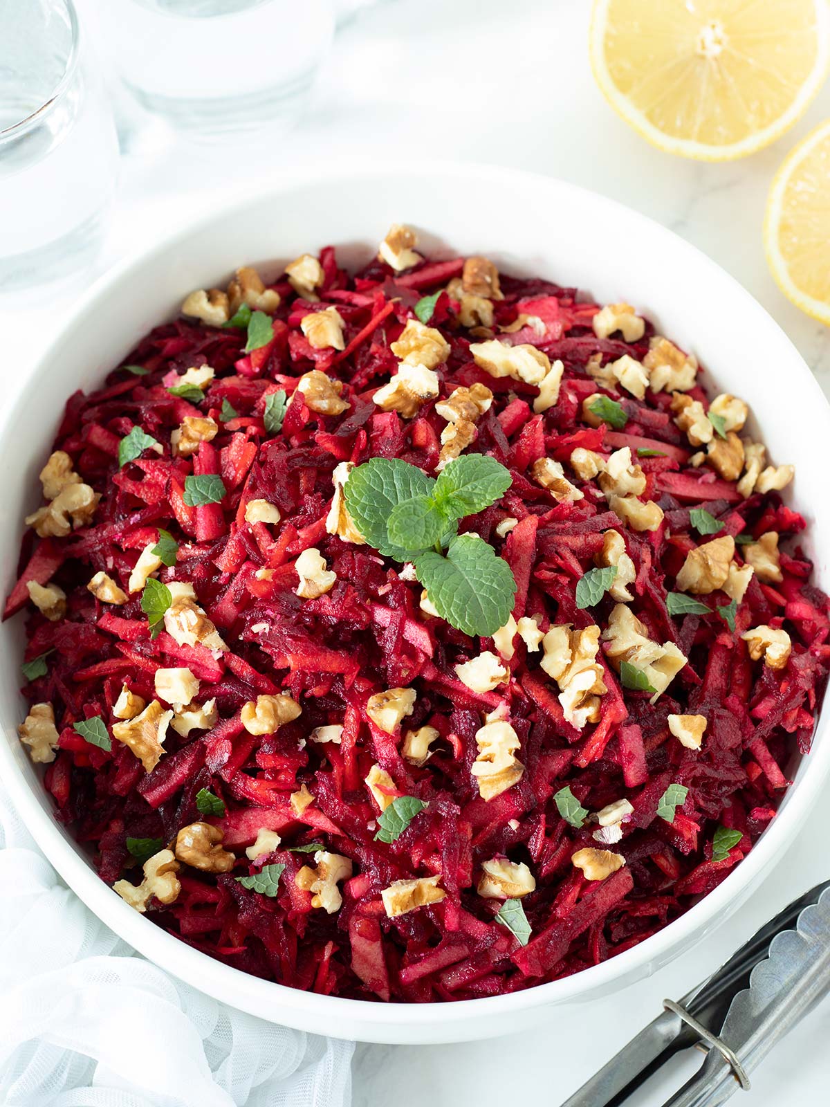Raw beetroot carrot apple salad with walnuts.