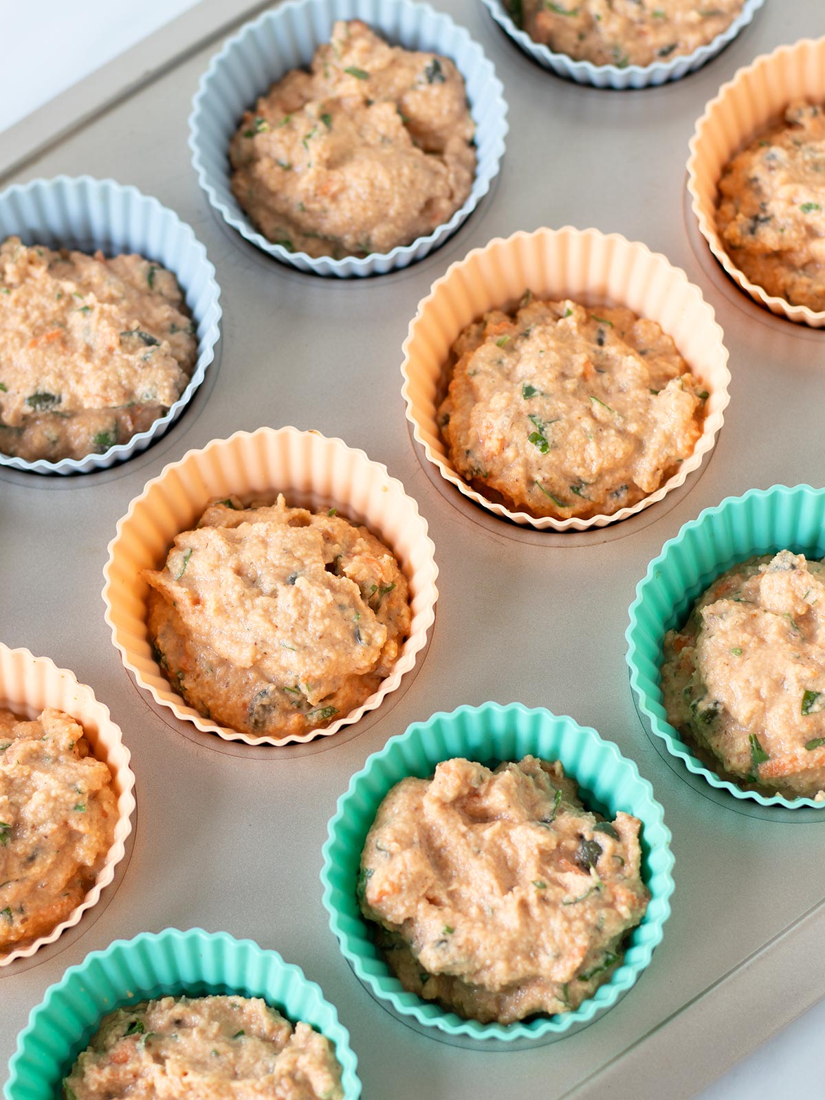 Savory red lentil muffins prepared for baking.