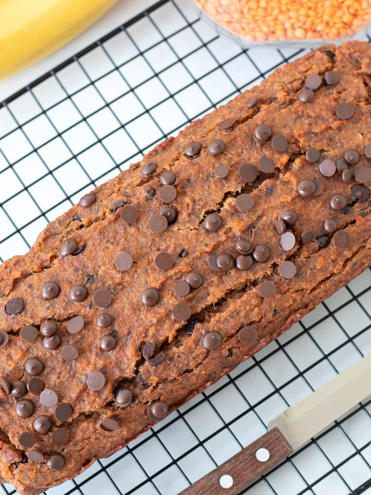 Freshly baked red lentil banana bread with chocolate chips.