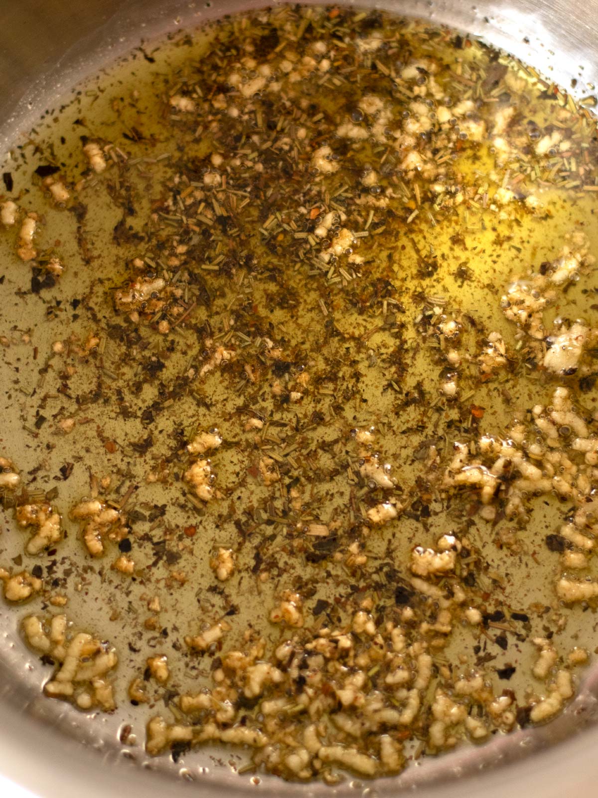 Cooking aromatics for chickpea pasta.