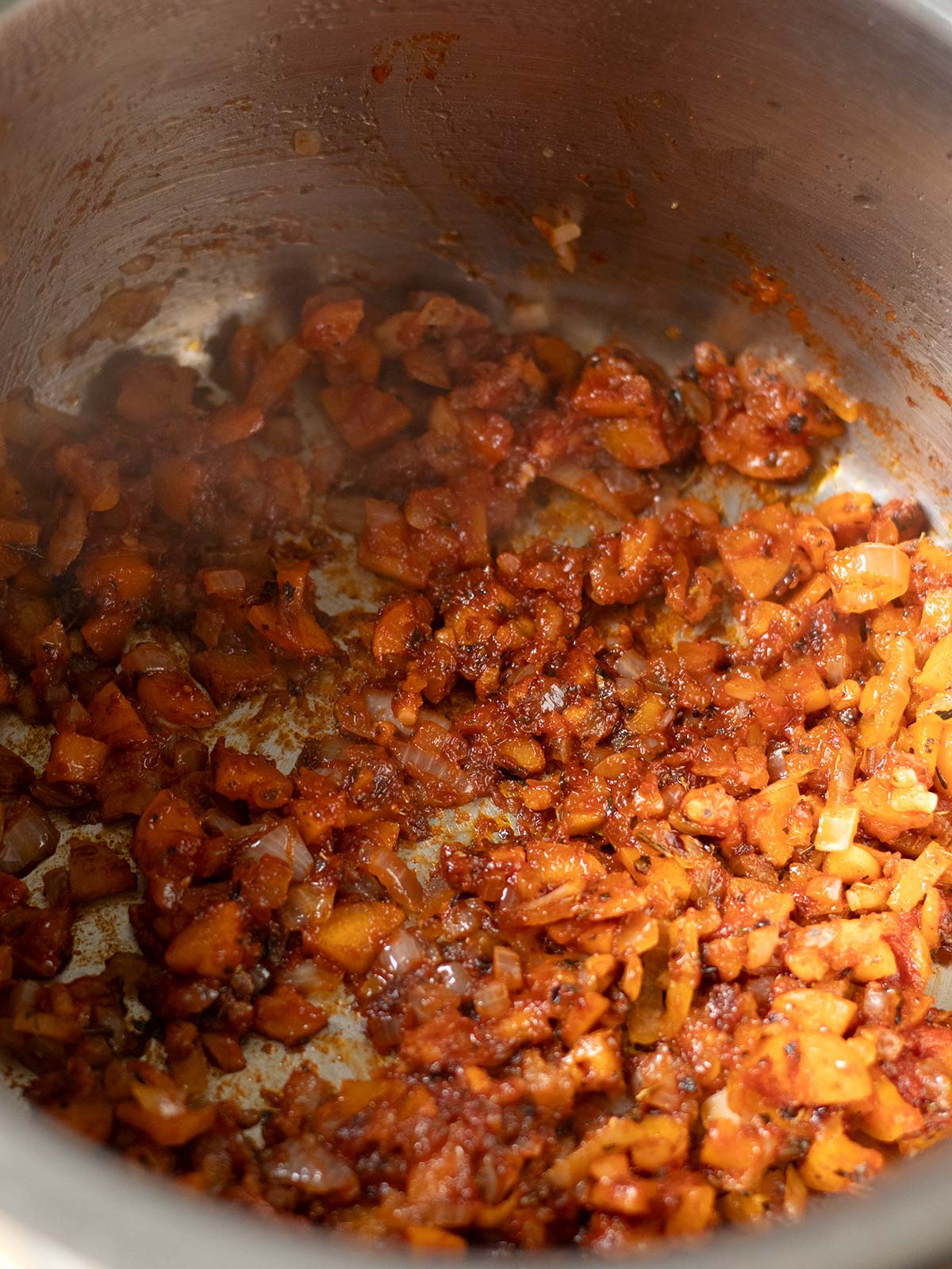 Cooking aromatics for vegan TVP bolognese sauce.