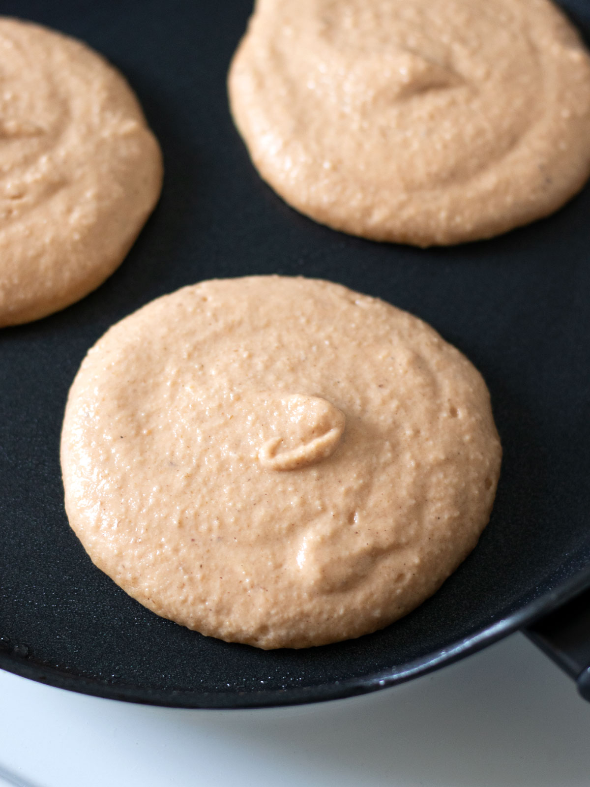 Cooking sweet lentil banana pancakes with oats.