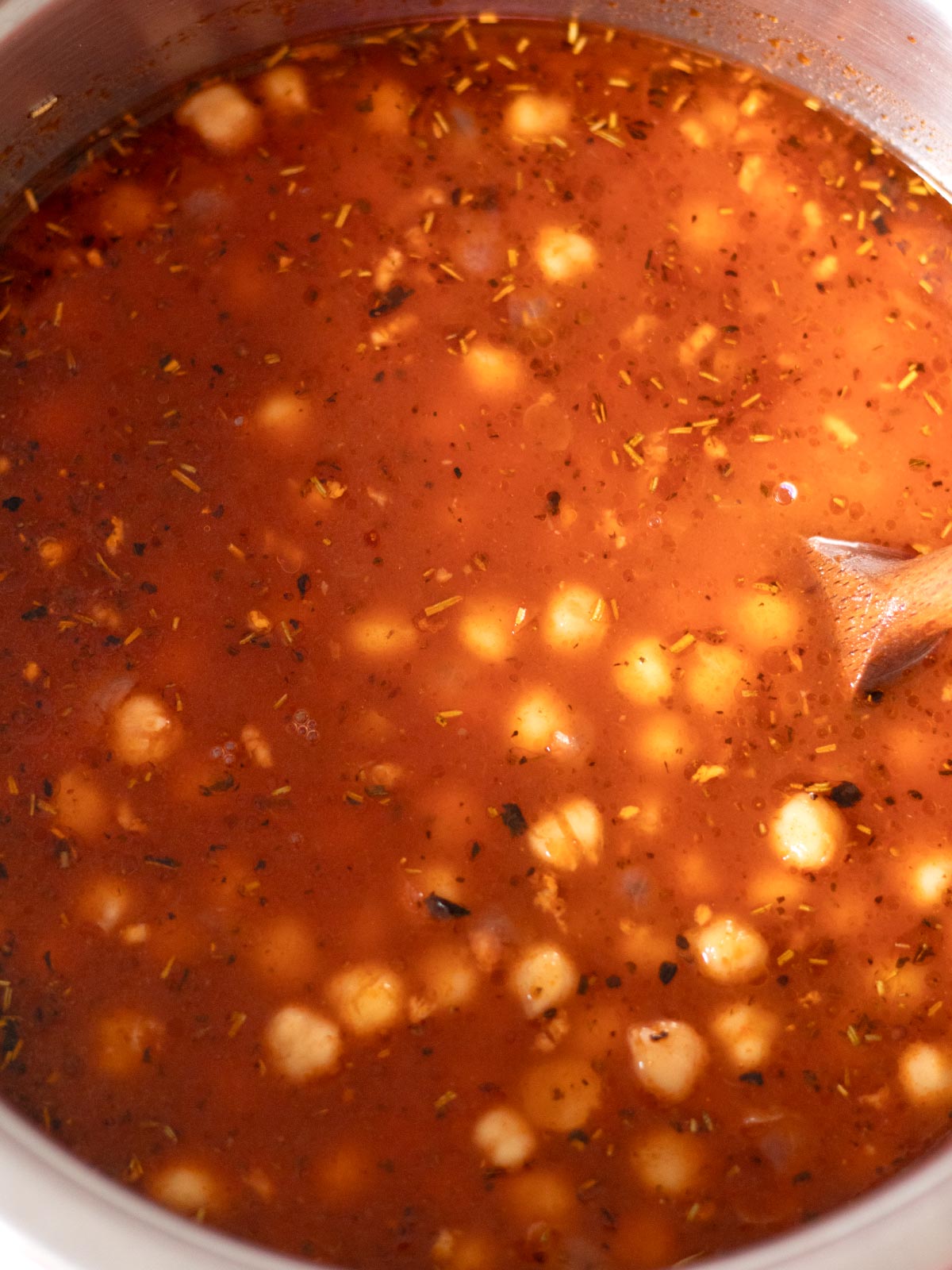 Cooking vegan chickpea pasta.