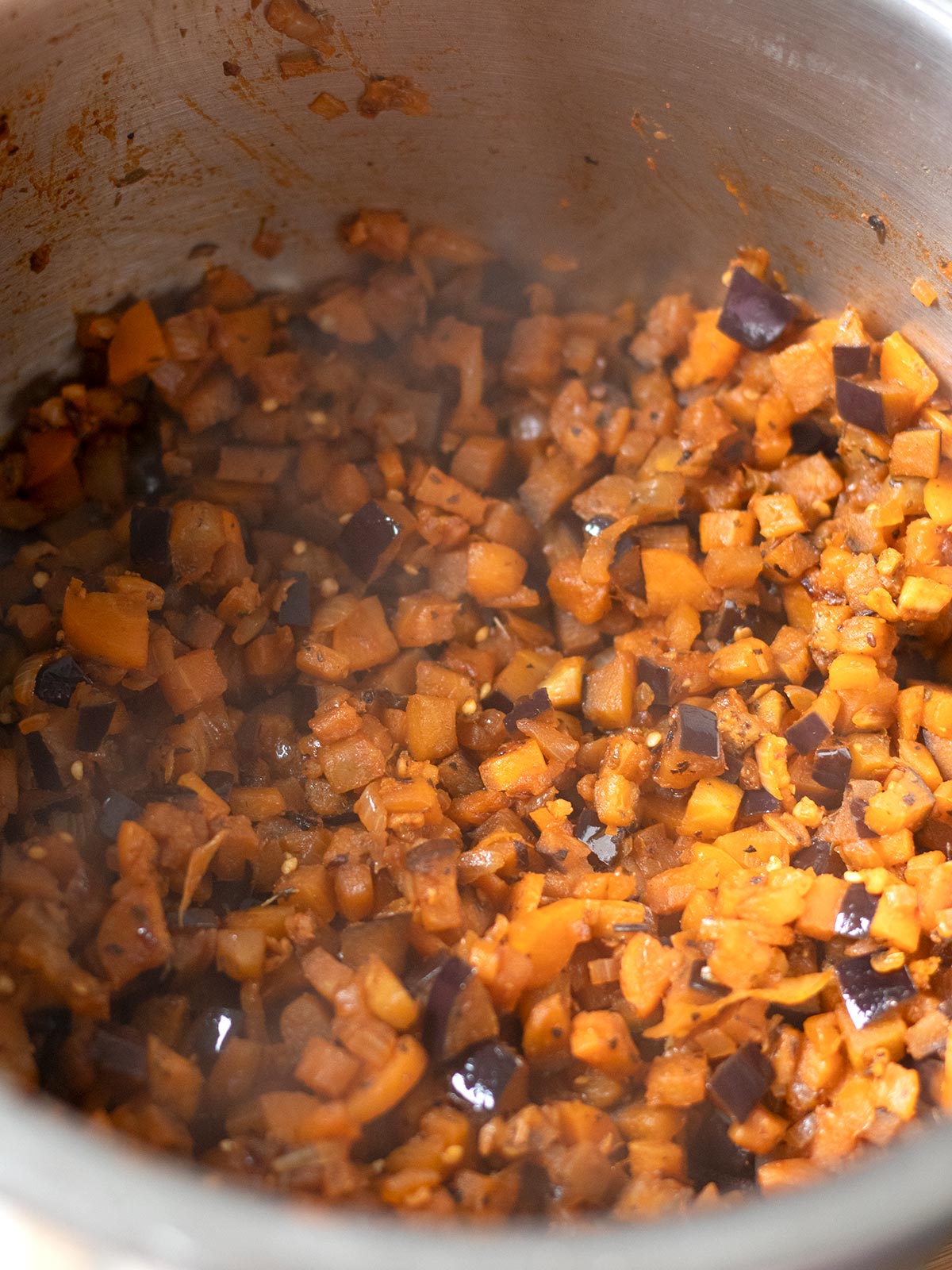 Cooking veggies for vegan TVP bolognese sauce.