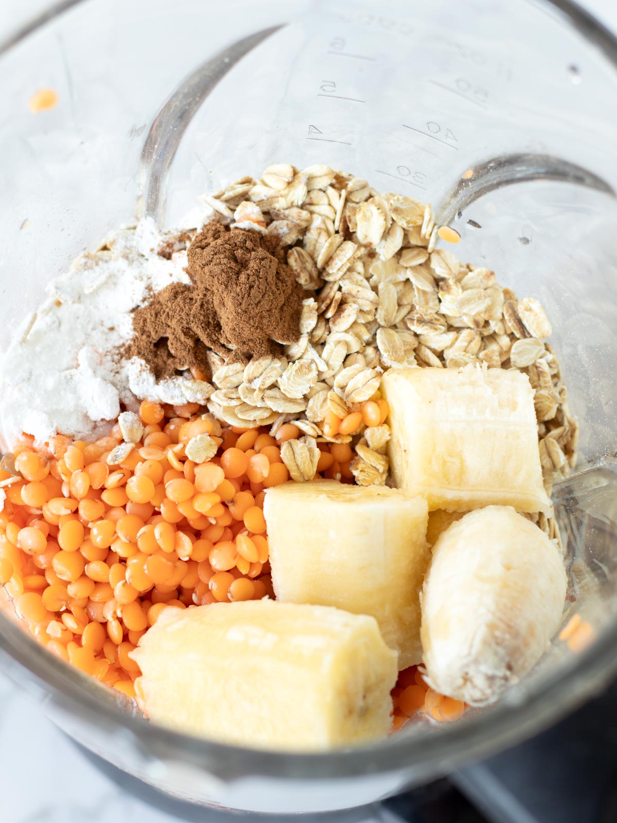 Red lentil oatmeal banana pancakes ingredients in a blender.