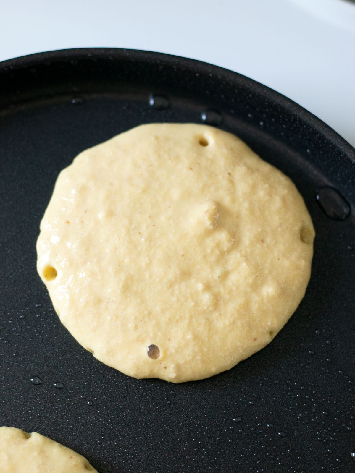 Cooking vegan banana chickpea pancakes.