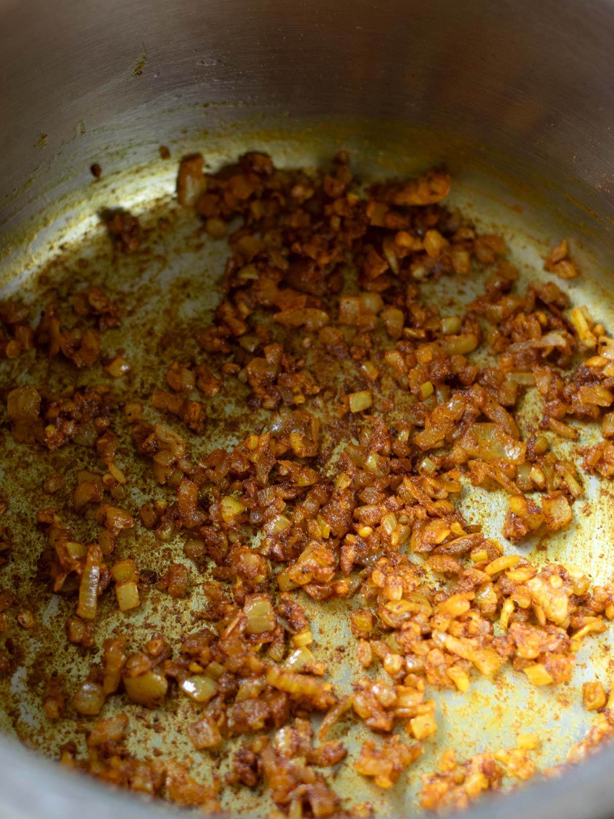 Sauteing onion, garlic, and spices for red lentil sweet potato soup.
