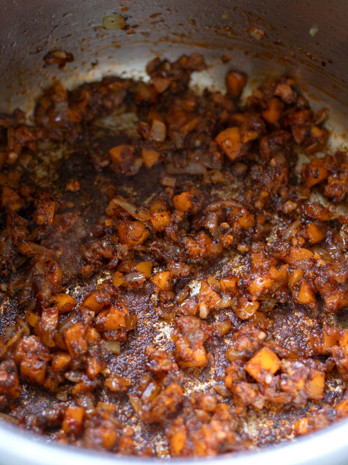 Cooking aromatics for lentil rice bulgur soup.