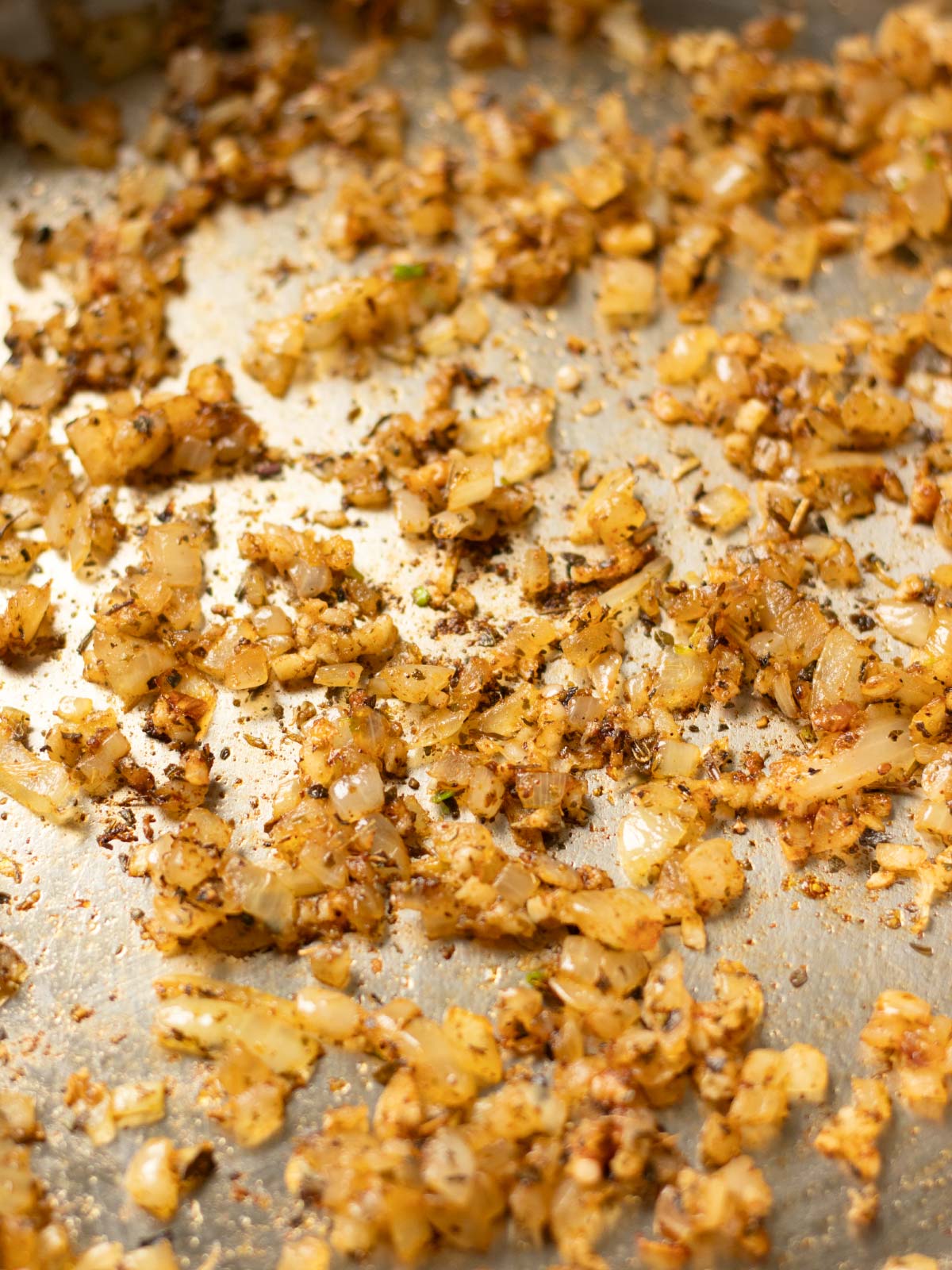 Cooking aromatics for tofu tomato pasta sauce.