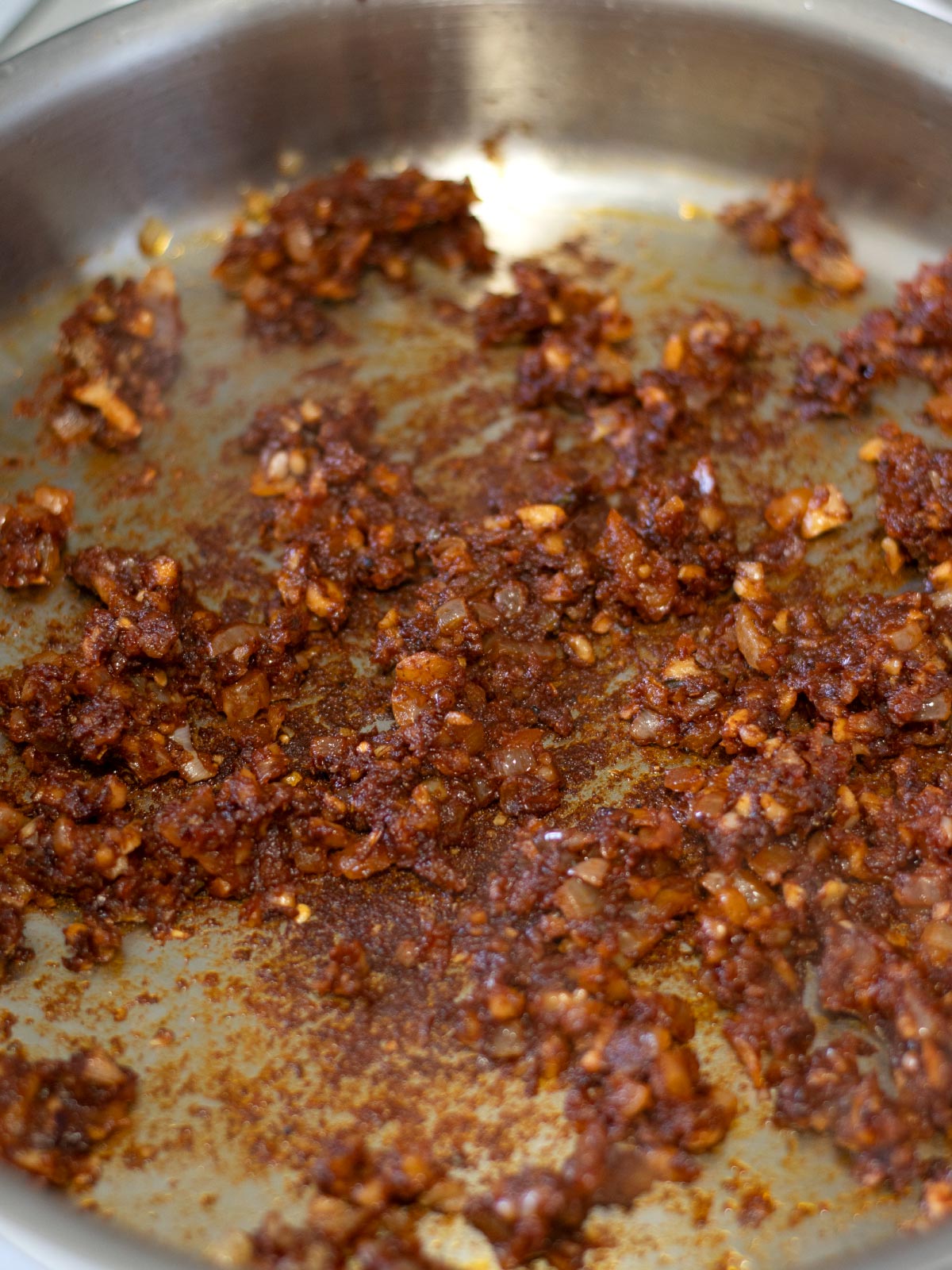 Sauteing aromatics for vegan lentil taco meat.