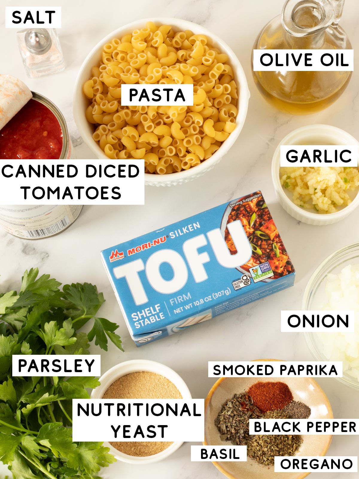 Vegan ingredients for silken tofu tomato pasta.